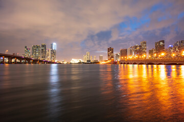 Fototapeta na wymiar Night Florida Miami city skyline. USA skyscrappers downtown. Landscape of twighlight town.