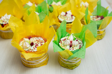 Sweet Easter cakes decorated in yellow-green paper