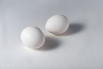Eggs two pieces in a white shell, on a white background with a shadow