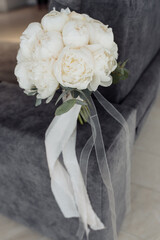 wedding details. the bride's bouquet. peonies.wedding gatherings of the bride.wedding rings with precious stones.