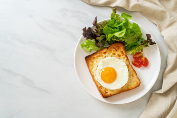 bread toasted with cheese and fried egg