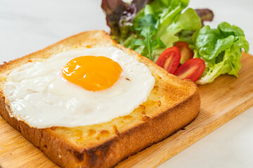 bread toasted with cheese and fried egg
