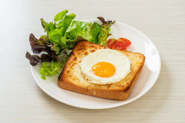 bread toasted with cheese and fried egg