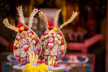 Red candles and burning incense sticks Paper gold with the Chinese alphabet Blessings written on it...