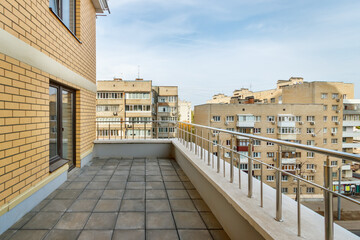 Empty terrace on modern new high-rise residential building in city