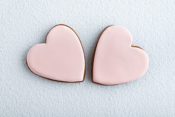 Homemade light pink Valentines Day cookies shape of hearts. Mothers day. Womans day.