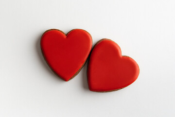Two red gingerbread hearts on white background, top view. Valentines day
