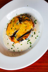 Delicious Greek moussaka from baked eggplant, tuna, cheese and bechamel sauce..