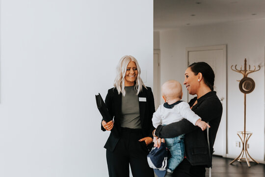 Estate agent showing woman house