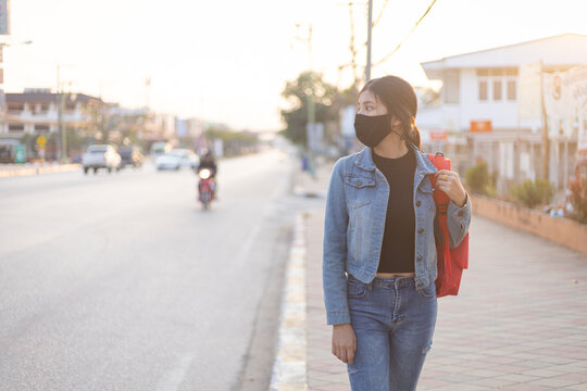 Asian woman tourist wearing face mask. Coronavirus flu virus travel concept