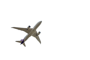 Under view of airplane for commercial passenger or cargo transportation flying isolated on white background with clipping path