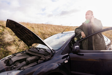 Man in car talking via cell phone