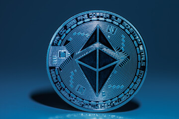 single blue shining ether coin from ethereum with shadow