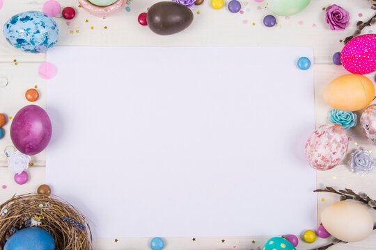 Colorful background with Easter eggs on white wooden board background. Happy Easter concept. Can be used as poster, background, holiday card