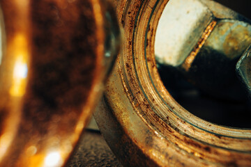 Macro shot of metal nuts on textured surface