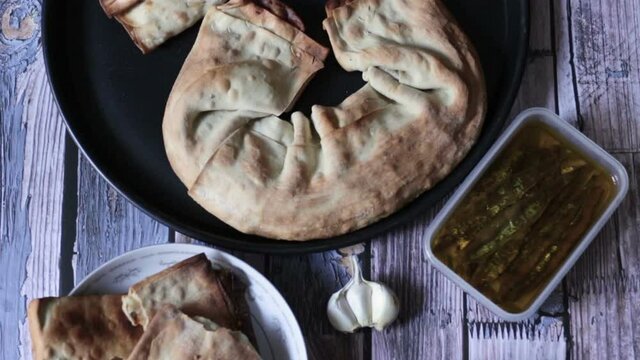 Pizza Puff with Anchovies. Traditional peasant dish.
