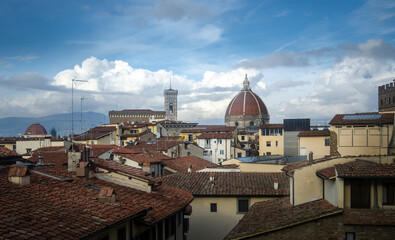 The Duomo in Florence, the Cathedral of Santa Maria del Fiore with beautiful lights from the top at cloudy day in Florence, Italy