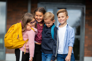 Children standing in front of school