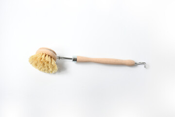 Wooden dish brush with bamboo wood and natural Bristle Tampico Fiber, on white background  . Item for cleaning in kitchen.
