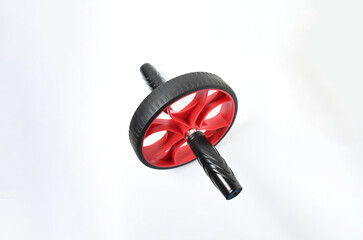 Sport item object, balck and red ab roller wheel on white background with space for text. Essential...