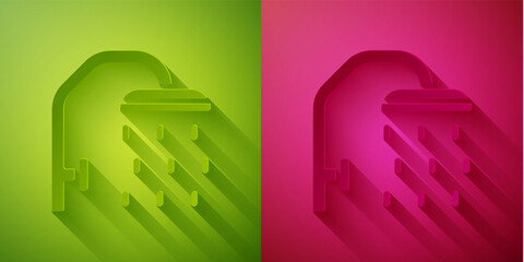Paper cut Shower head with water drops flowing icon isolated on green and pink background. Paper art style. Vector.