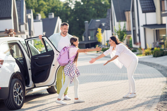 Photo Portrait Of Daughter Coming Back To Mother After Long School Day Exiting White Car Outdoors On Street In Summer