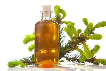 Essence of pine on table in beautiful glass jar
