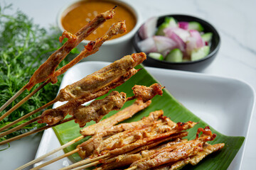 Pork satay with peanut sauce or sweet and sour sauce, Thai food