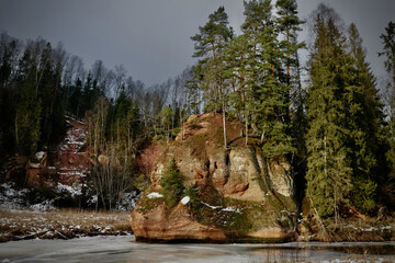 red sand stone by river