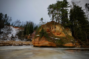 red sand stone by river