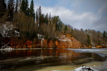 red sand stone by river