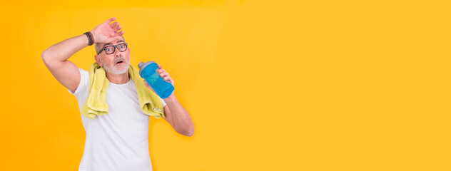attractive adult man exhausted from sports drinking