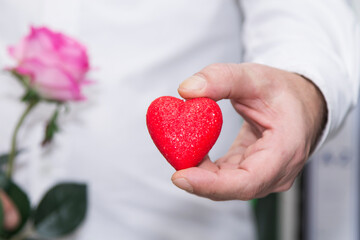 man giving the heart as a gift for Valentine's Day, happy February 14 and Valentine's Day