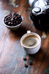 Cup of coffee on rustic wooden background. Close up.	