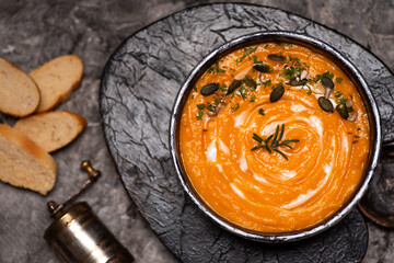 Pumpkin soup on a rustic setup