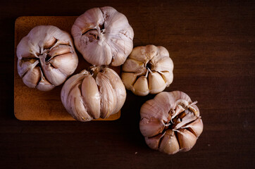 White onions on wooden table, top view