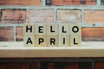 Fototapeta na wymiar Hello April alphabet letter on shelves wooden background