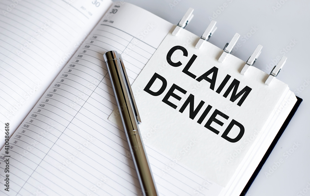 Poster text claim denied on the short note texture background with pen
