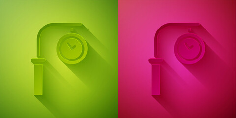 Paper cut Train station clock icon isolated on green and pink background. Paper art style. Vector.