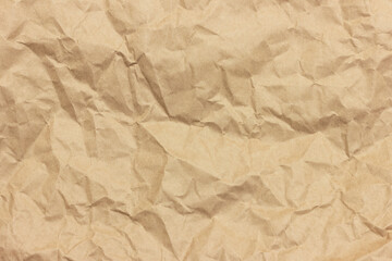 The texture of crumpled brown craft paper.