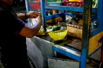 Indonesian hawker street food cooking noodle frying at night