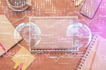 Fototapeta na wymiar Double exposure of forex chart hologram over desktop with phone. Top view. Mobile trade platform concept.