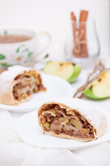 Apple strudel with cinnamon, nuts, vertical.