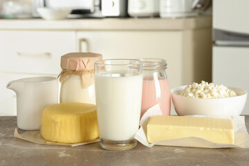 Different fresh dairy products on gray table