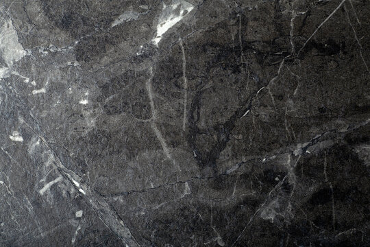 Black marble background. Background with texture and pattern of black stone, marble or granite.
