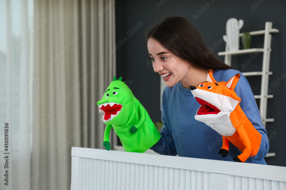 Sticker Young woman performing puppet show at home