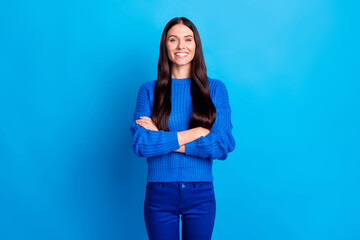 Photo of brunette optimistic lady arms crossed wear blue sweater pants isolated on bright color background