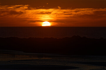 The sunsets over the sea on the West Coast of New Zealand
