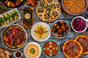 Many kinds of foods and appetizer on the dining table. Fasting concept with iftar table