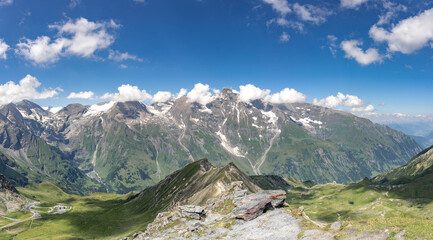 Fototapeta na wymiar Clouds over summit at Grossglockner mountain range view from Taxenbacher Fusch high alpine road in Austria